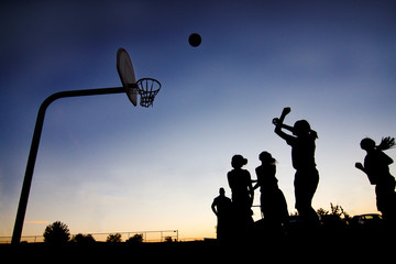 Street basketball players in silhouette