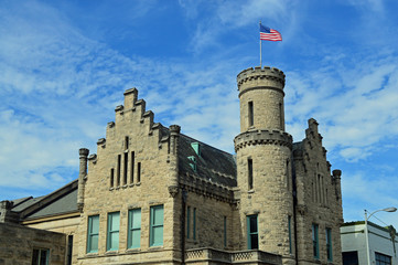 City landscape photo of an historic preserved building in the downtown area of a city