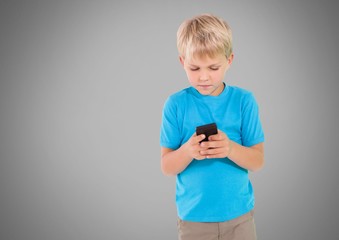 Boy against grey background with phone