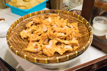Thai style deep-fried pork dumpling in wicker basket