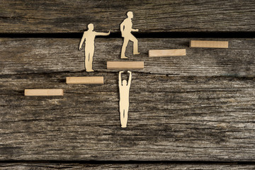 Teamwork concept using cut outs of paper men