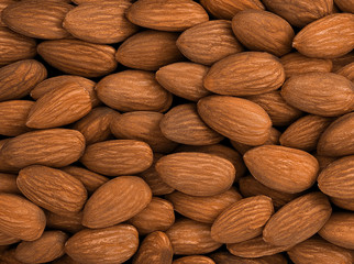 carefully laid out cleaned almonds background 