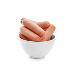 Bowl with delicious sausages on white background