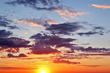 Fototapeta na wymiar evening sunset with vivid clouds