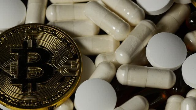 Golden Bitcoin On The Background Of Pills