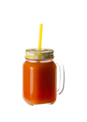 isolate carrot juice in a glass with a lid and a tube