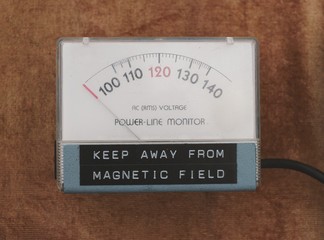 A vintage power-line monitor that also reads keep away from magnetic field.