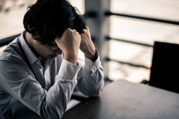 business man is stressed from his work. depression and anxiety concept.