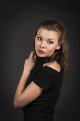Portrait of a girl on a dark background.