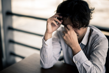 business man is stressed from his work. depression and anxiety concept.