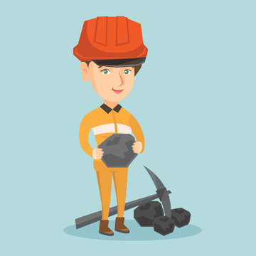 Caucasian female miner in hard hat holding a piece of coal in hands. Young smiling miner in workwear standing near a pickaxe and coal. Vector cartoon illustration. Square layout.