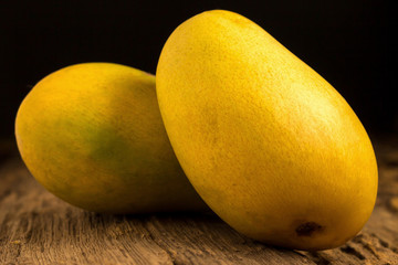 mango on a dark wood background