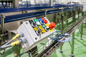 Emergency Stop installed at line conveyor for machine factory, START - STOP Button for industrial...