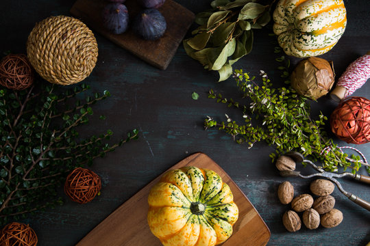 A still life of different sorts of autumnal leaves and crops