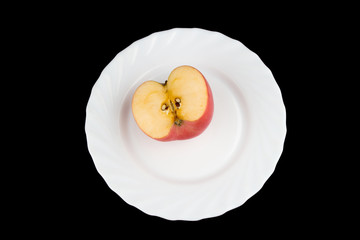 apple on black background. dish