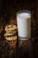Homemade cookies with milk on wooden table background. selective focus