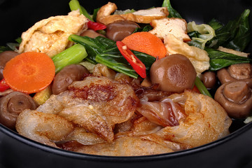 Fried big noodle topped mixed vegetables for organic food.