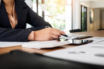 Administrator business man financial inspector and secretary making report, calculating balance. Internal Revenue Service checking document. Audit concept.