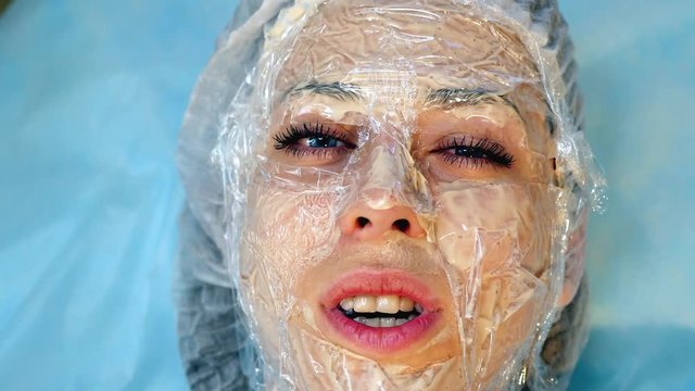 Skin Rejuvenation Treatment massage with facial cream, 4k footage.