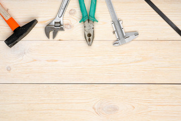 hand tools on wooden planks