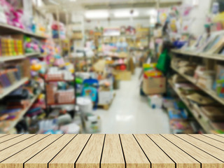 wooden table with Blur shopping mall background