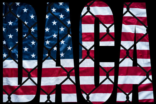 DACA bold letters with american flag and chain link fence in the background