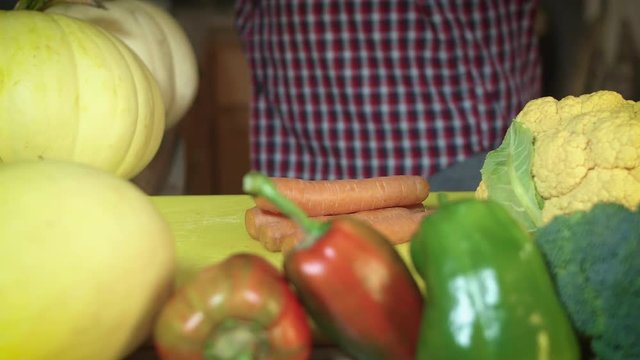 Preparing Organic Food Chopping Carrots by Fresh Vegetables Framing