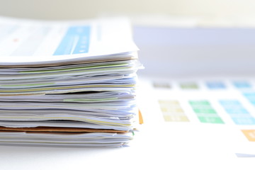 Stack of financial documents on desk,business concept.