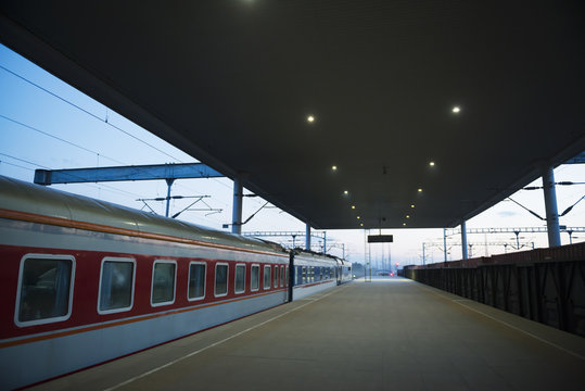 Platform at railway station in evening
