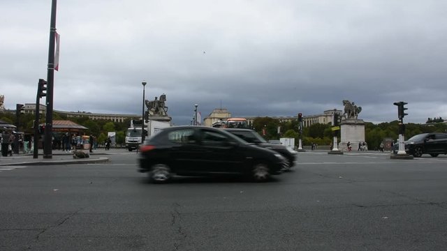 French people driving and biking with travelers walking and traffic road at front of Musee du Louvre or the Grand Louvre Museum on September 5, 2017 in Paris, France