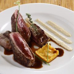 Grilled beef steak with red wine and tropical sour sauce.