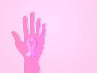 Fototapeta premium hands with awareness ribbon paper art