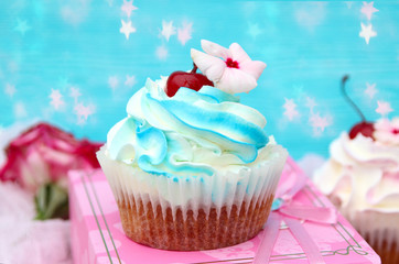 cake and cream on a blue background. sweet pastries