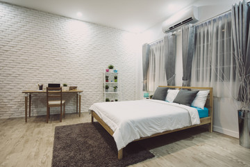 Stylish designed boy teenager's bedroom with white walls