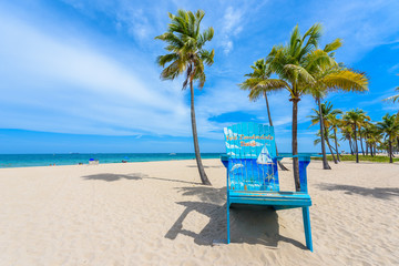 Paradise beach at Fort Lauderdale in Florida on a beautiful sumer day. Tropical beach with palms at white beach. USA.