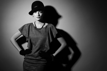 young elegant woman, retro fashion, hat, gloves, dress.