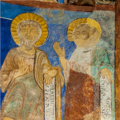 Two disciples with latin texts in a medieval fresco