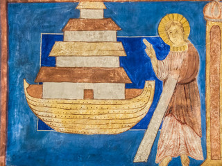 The biblical Noah in front of  the ark, with an ultramarine background. Romanesque painting © Stig Alenas