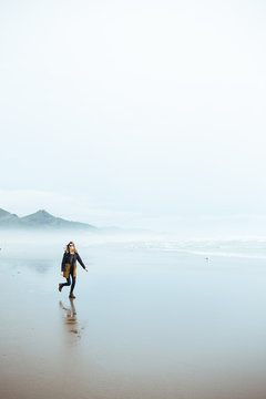 Girl Running On The Beach In Oregon