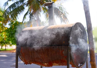 Gordijnen Rusted iron barrel barbecue in Mexico © lunamarina