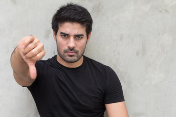 man giving rejecting thumb down