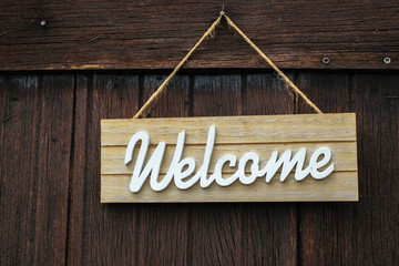 Welcome sign on wooden wall