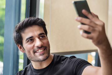 happy man using smartphone app