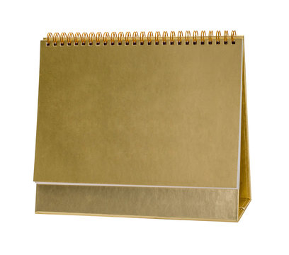 Blank paper desk spiral calendar with gold gilt covering.