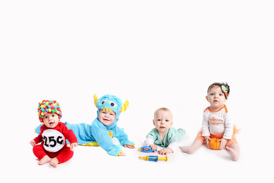 Babies dressed up in Halloween Costumes