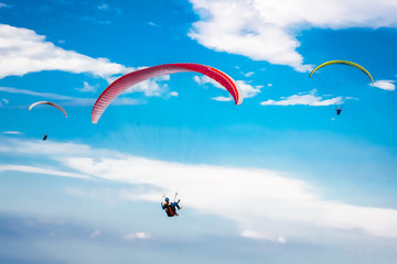 Paragliding in the blue sky