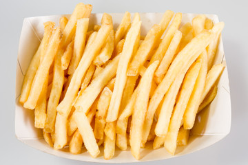 Blank french fries box in a white carton box isolated on white