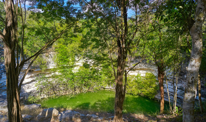 Fototapeta na wymiar Cenote Sagrado sacred sinkhole Chichen Itza