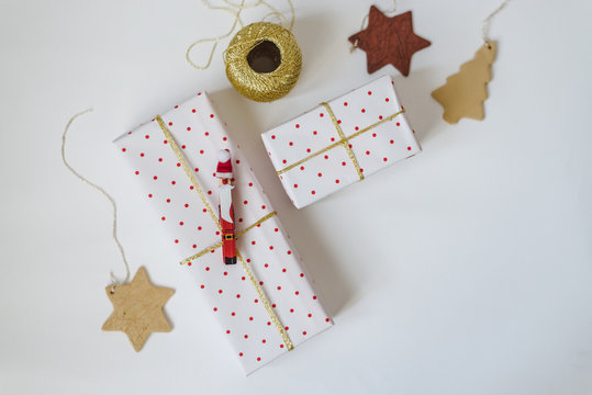 Christmas presents wrapped in polka dot paper on white