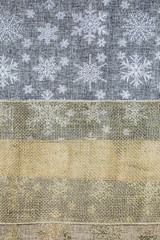 Gold and silver in burlap. Christmas background, top view, flat lay